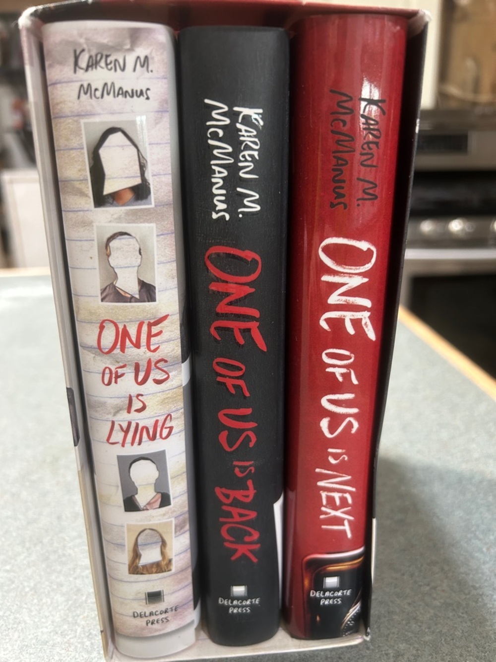 One of Us Is Lying by Karen M. McManus series of 3- Red & White Cover